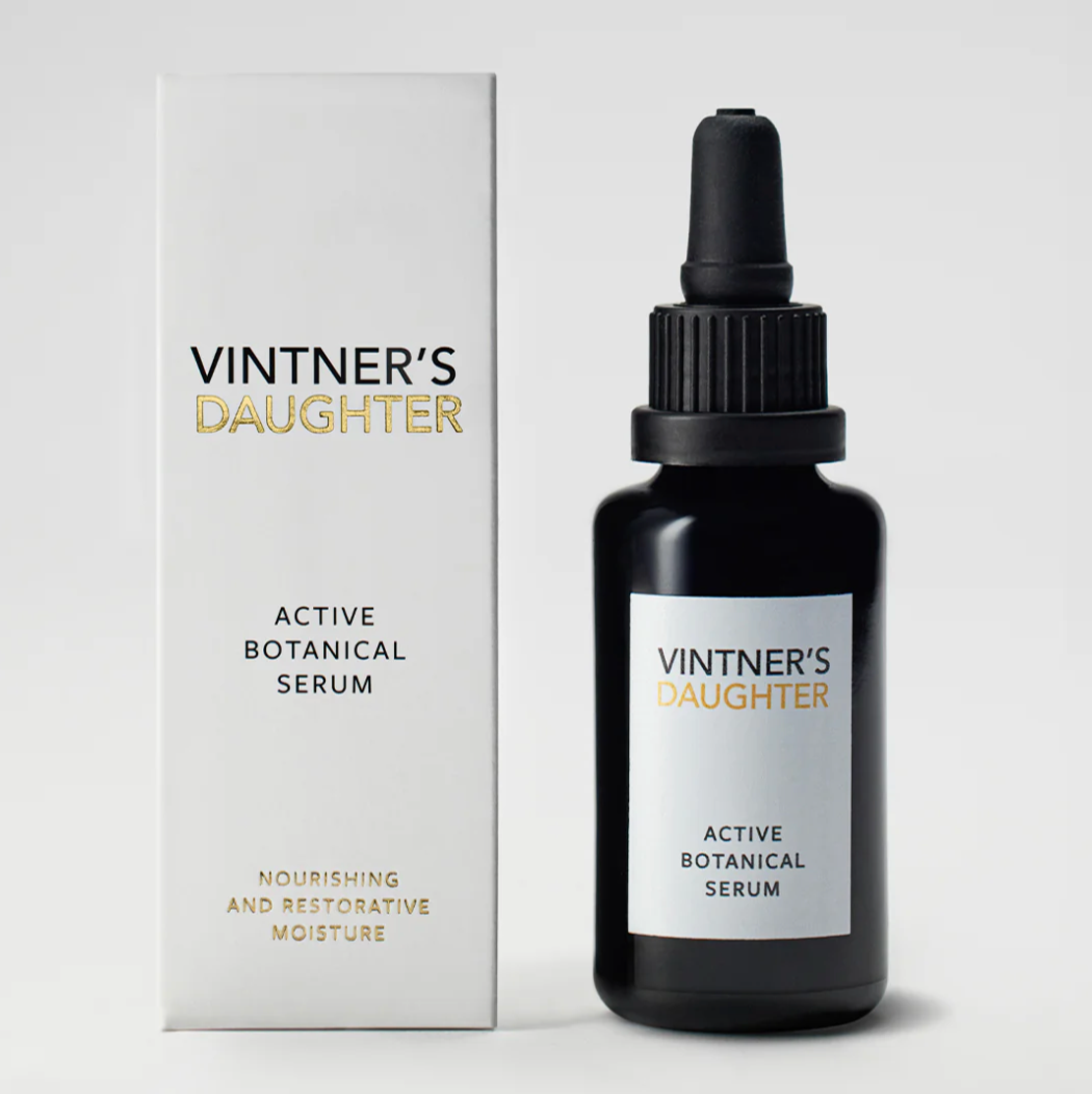 A black bottle with a dropper containing Active Botanical Serum, with a label that includes the brand name and product name. There is a badge indicating '35 BEST-OF AWARDS' on the upper right corner.