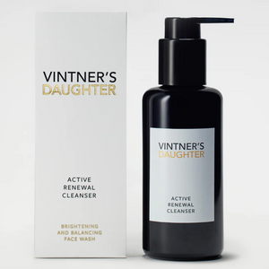 A bottle of Active Treatment Cleanser next to a white box. 