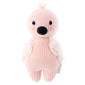 The Cuddle and Kind baby flamingo stuffed animal gives five meals to children in need when purchased