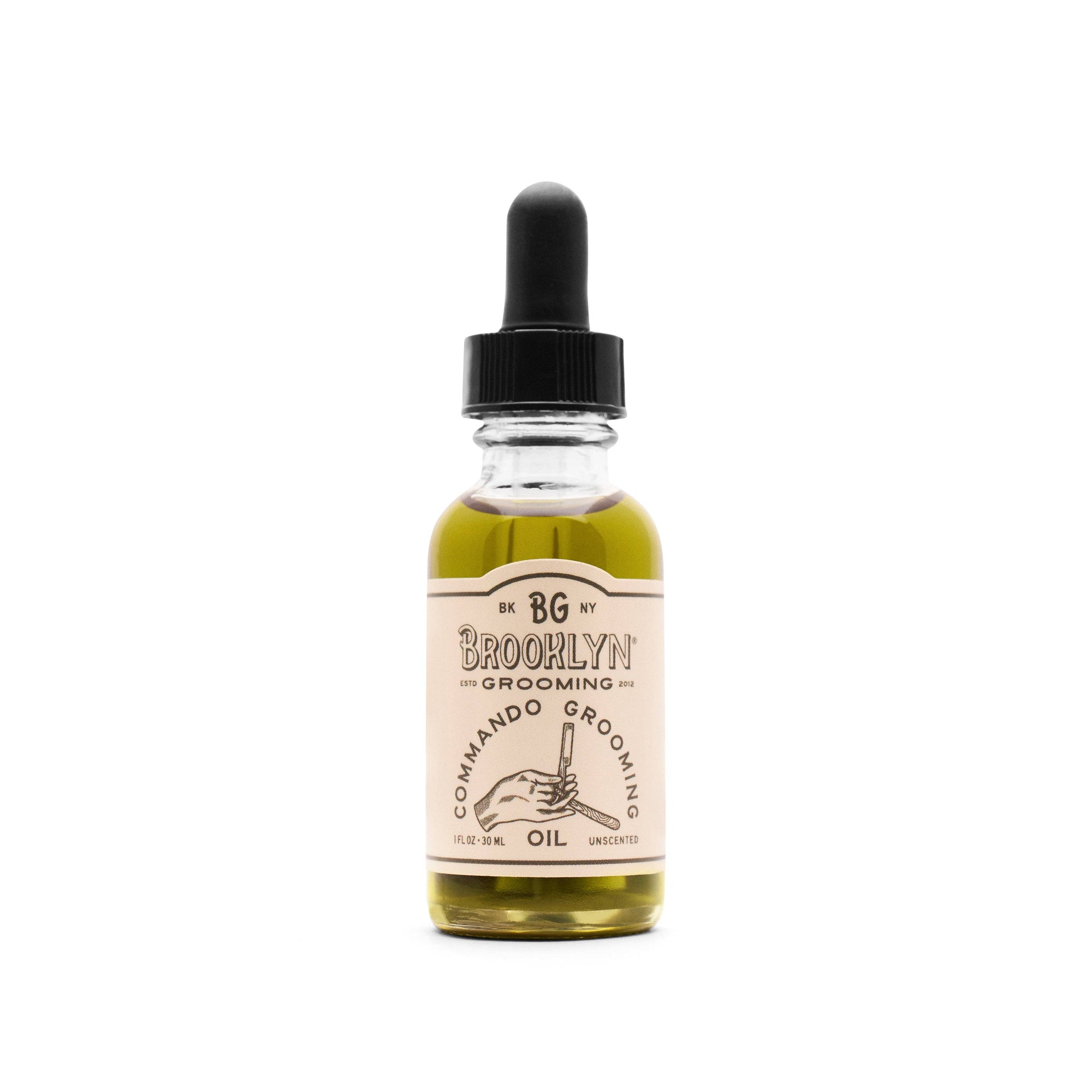 A bottle of Brooklyn Grooming Commando Grooming Oil with a dropper cap.