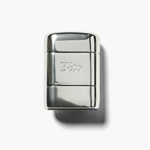 A silver Bite deodorant case. 