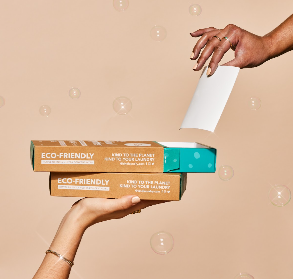 Packaging of Kind Laundry detergent sheets, with the brand's logo and the product's features highlighted, such as being fragrance-free and containing 60 sheets.