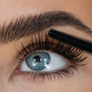 A person applying the cloud mascara to their eye