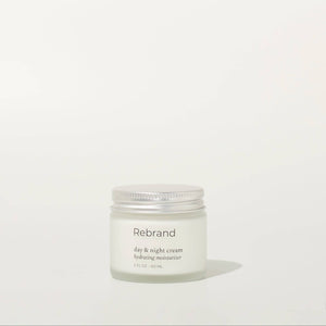 Jar of Rebrand day & night cream on a white background