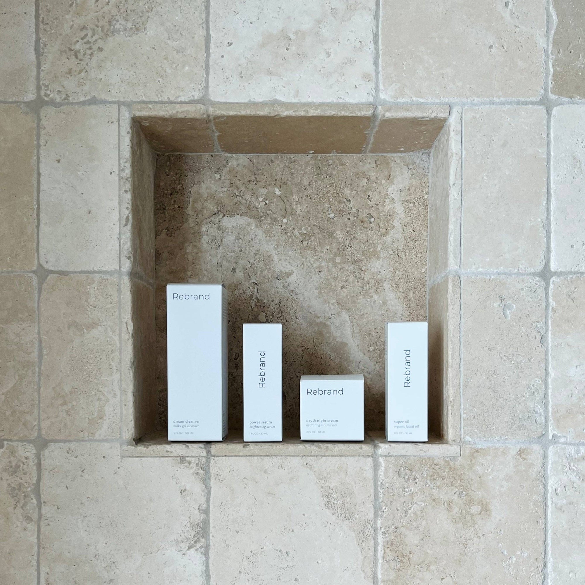 Four white boxes labeled 'Rebrand' in a recessed tiled wall.