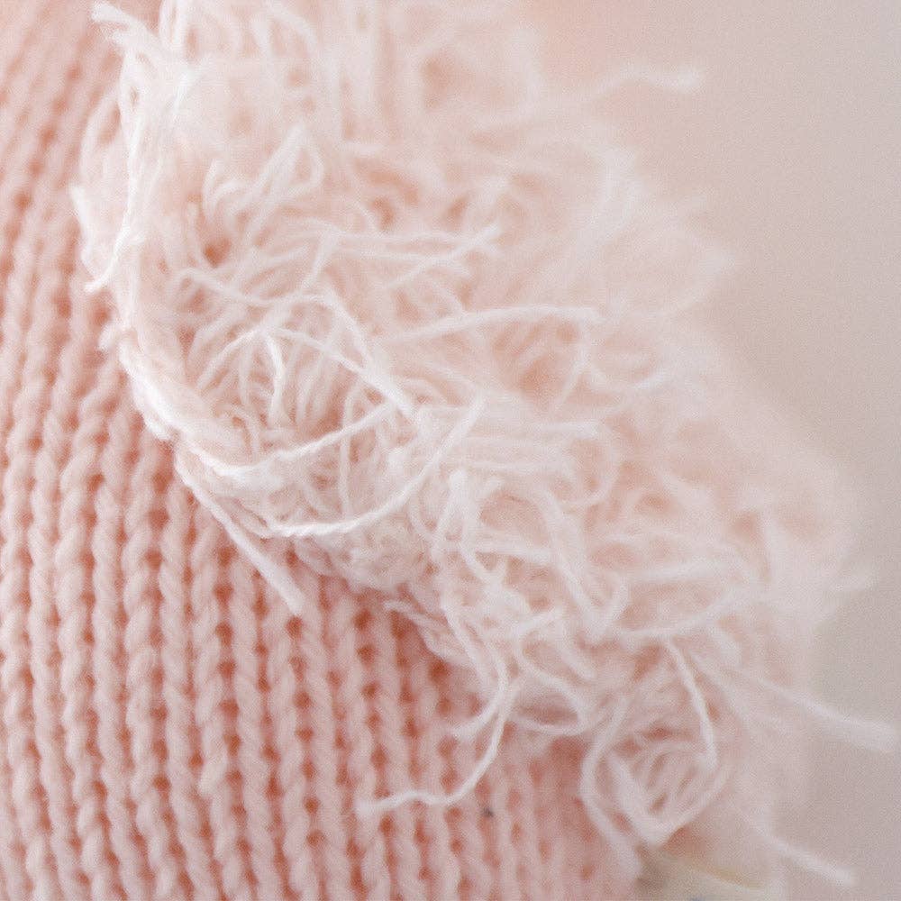 The Cuddle and Kind baby flamingo stuffed animal gives five meals to children in need when purchased