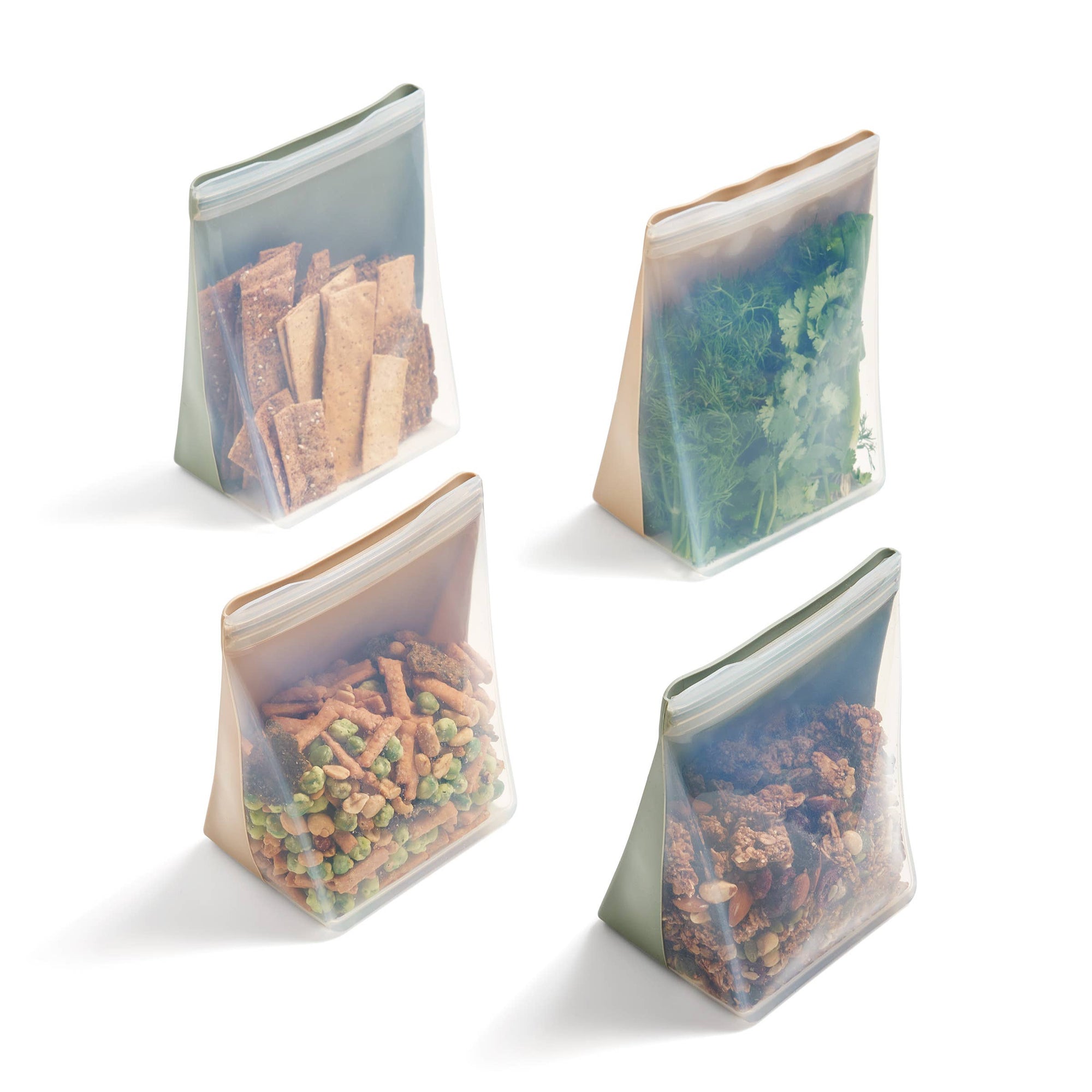 Four standup bags with various contents on a white surface. 
