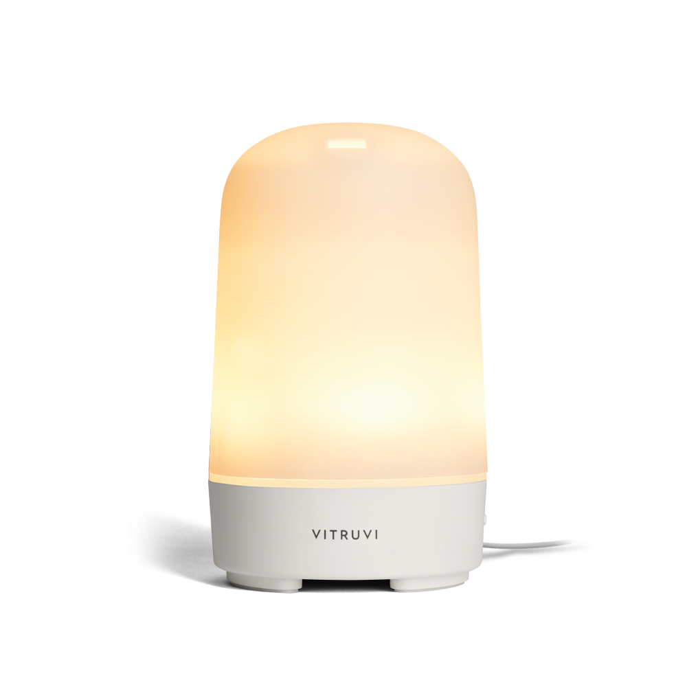 A Vitruvi Glow diffuser while lit