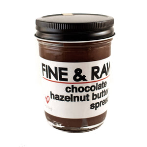 A jar of fine and raw chocolate hazelnut butter spread
