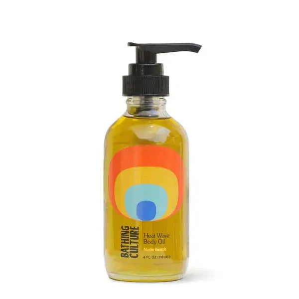 A bottle of heat wave body oil on a white background.