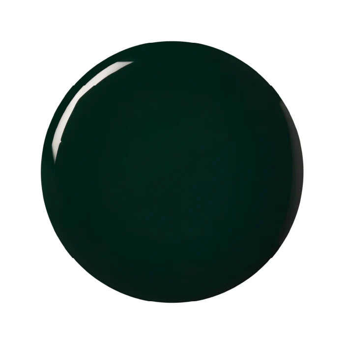 A bottle of Kure Bazaar nail polish in a deep green shade with a clear cap, labeled in Paris.