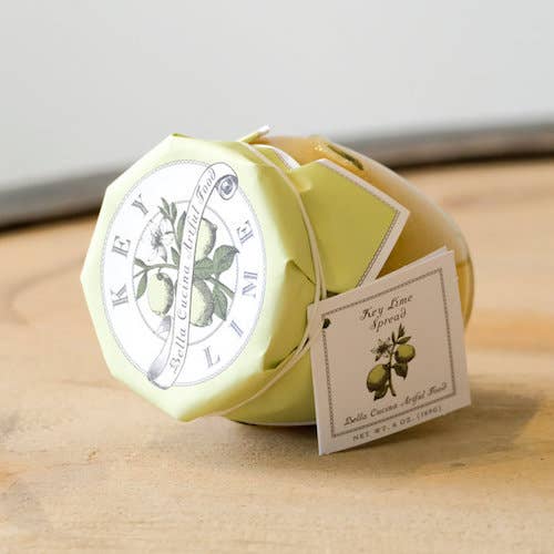 A bottle of Bella Cucina Key Lime Spread, laying on it's side