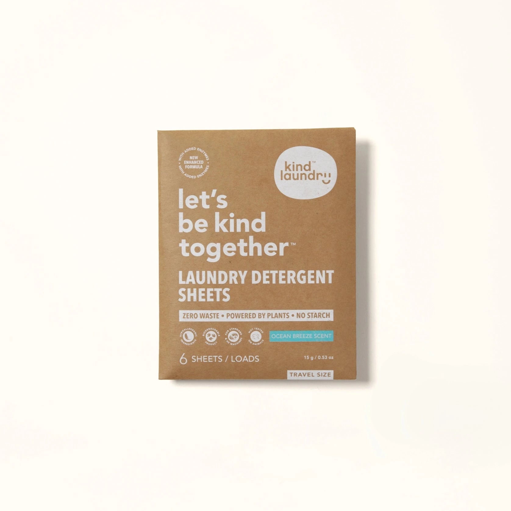 A travel pack of Kind Laundry detergent sheets in Ocean Breeze scent, with 6 sheets visible. The packaging is primarily brown with white and green text, and an image of a sea breeze.