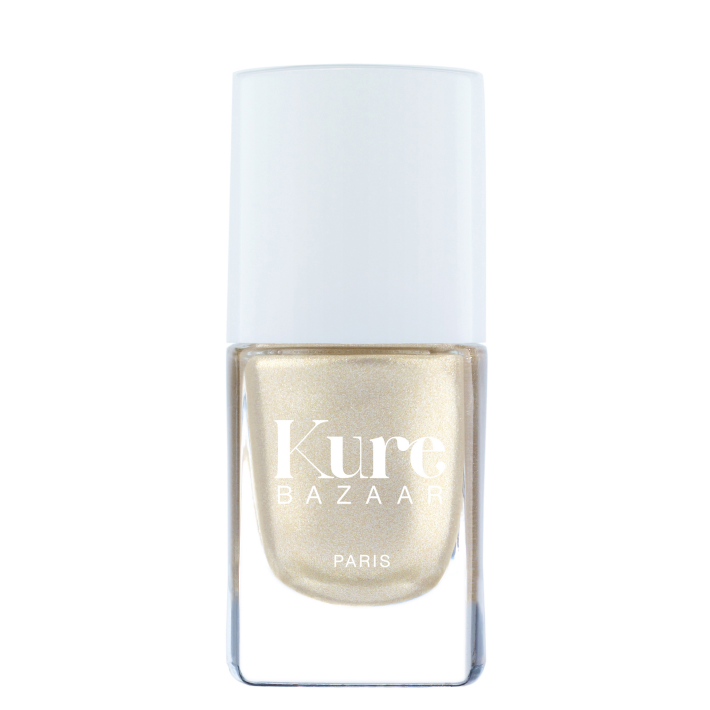 Kure Bazaar nail polish bottle with gold polish on a white background