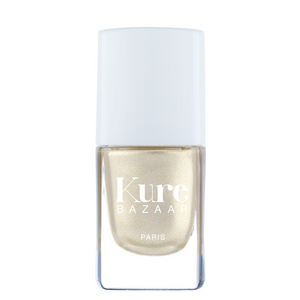 Kure Bazaar nail polish bottle with gold polish on a white background