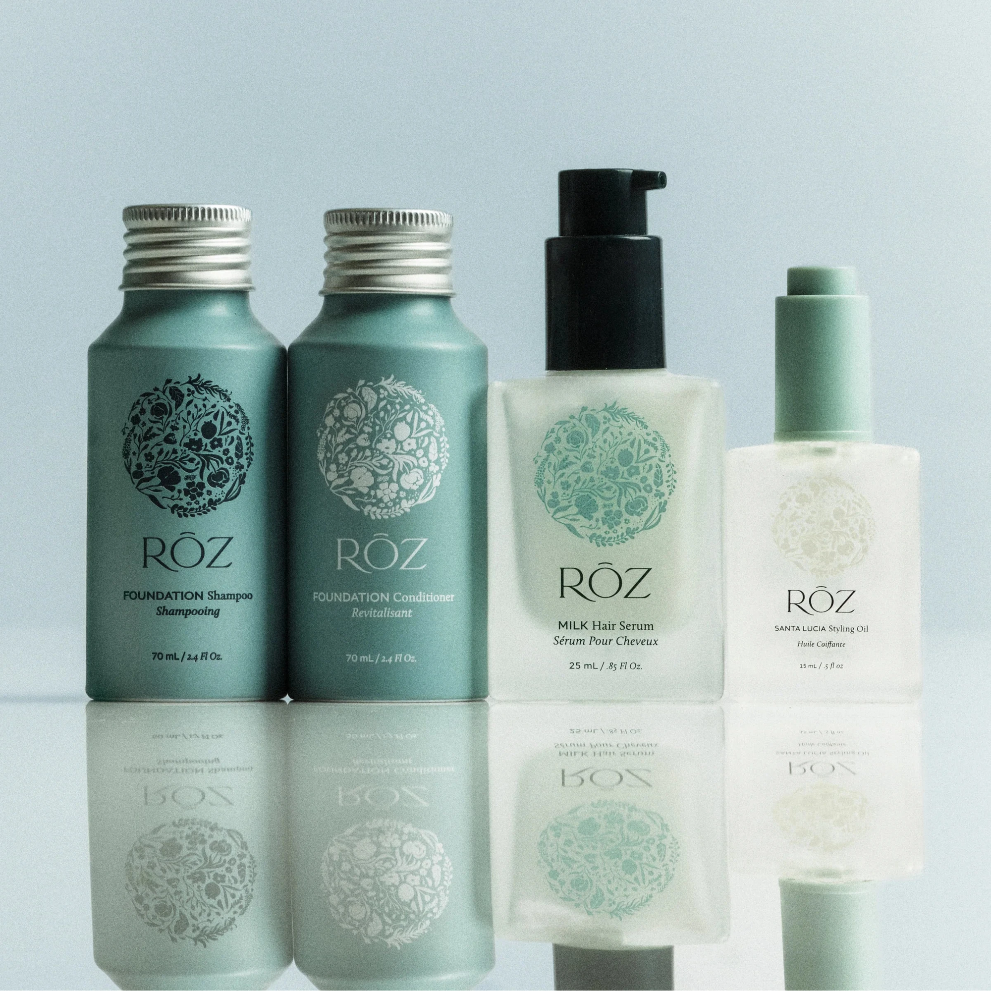 A ROZ Mini Essentials hair care kit with a pink bag.