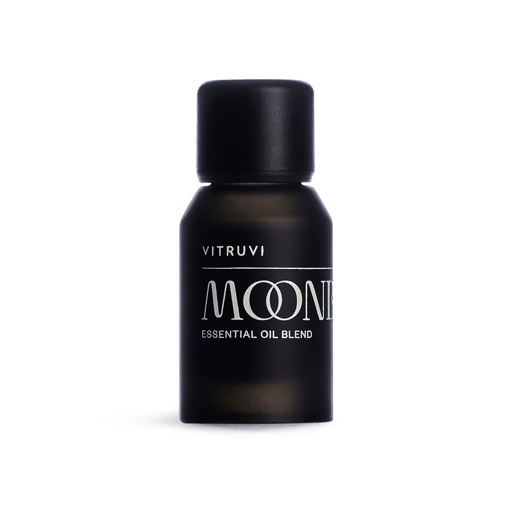 Black bottle of Vitruvi Moonbeam essential oil blend on a transparent background
