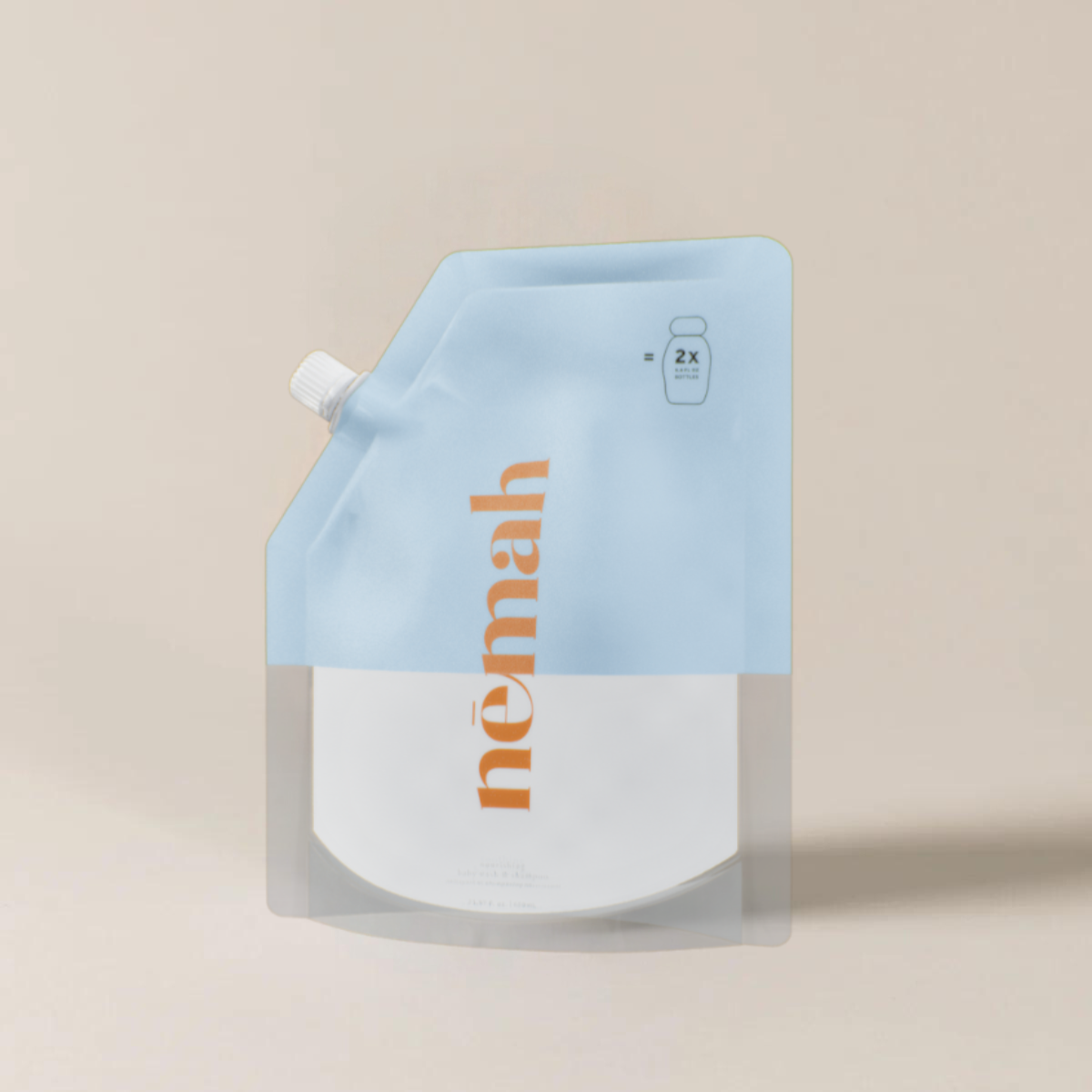 A plastic pouch labeled 'nemah' being held by a child, with another pouch in the background on a bathroom counter.