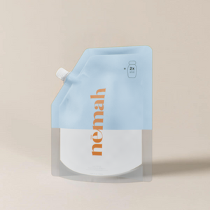 A blue and white refill bag of Nemah lotion. 