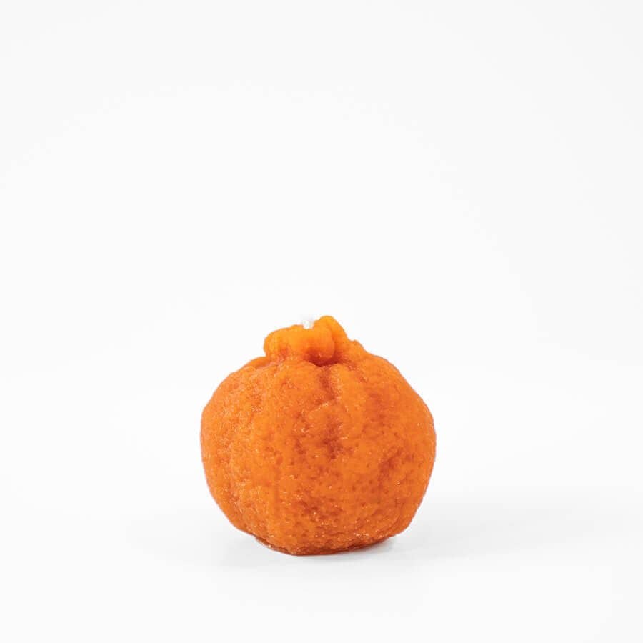 Happy Organics orange candle, hand made and organic.