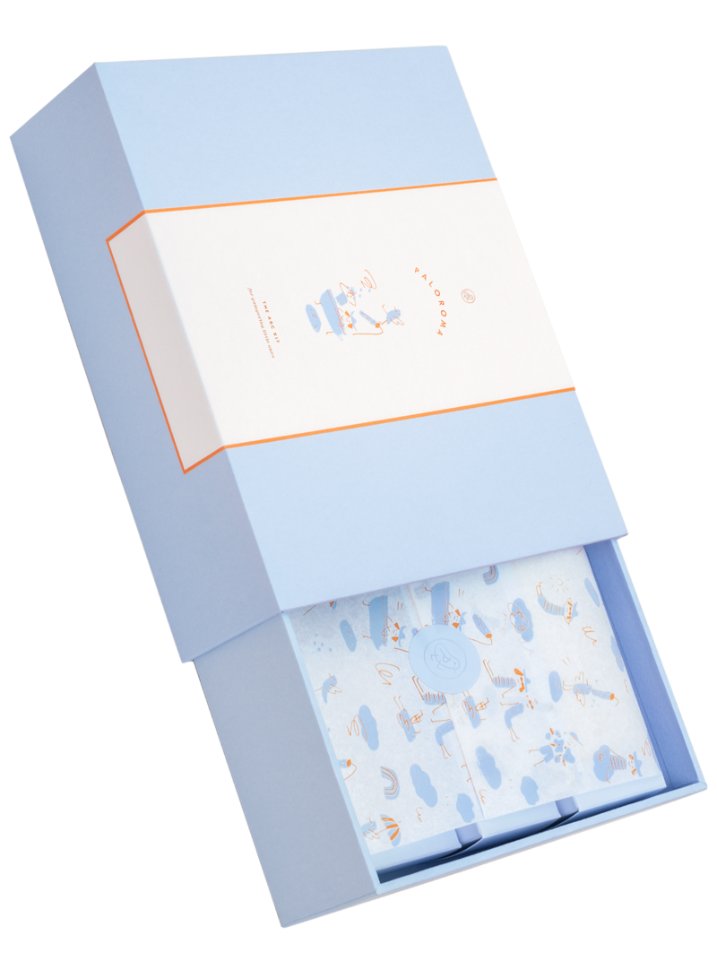 A blue box with pastel paper. The front says Paloroma. 