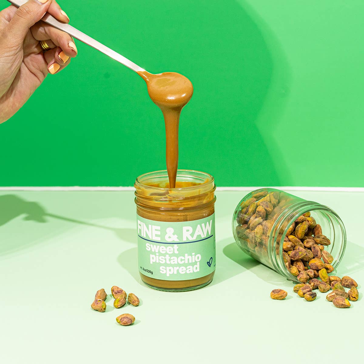 A jar of Fine and Raw sweet pistachio spread