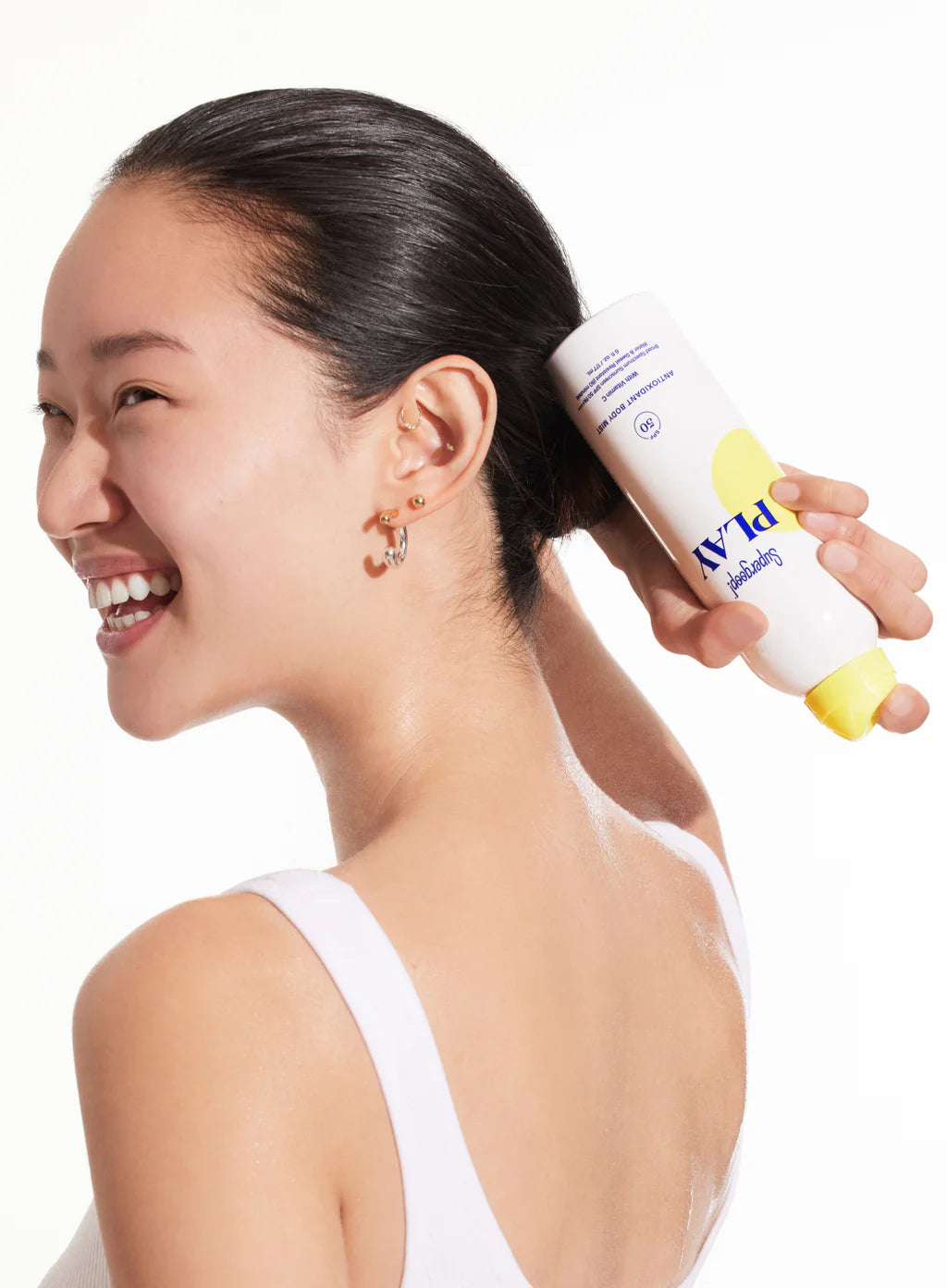 Supergoop! PLAY antioxidant body mist bottle on a white background