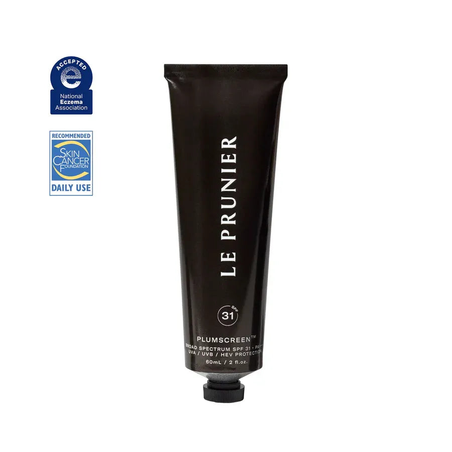A black tube of Le Prunier Plumscreen broad spectrum SPF 31 sunscreen, with product details and branding visible.