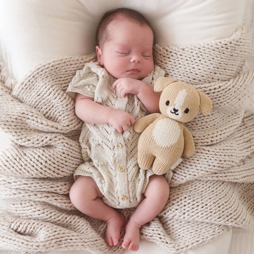 A cuddle and kind baby puppy stuffed animal with a baby
