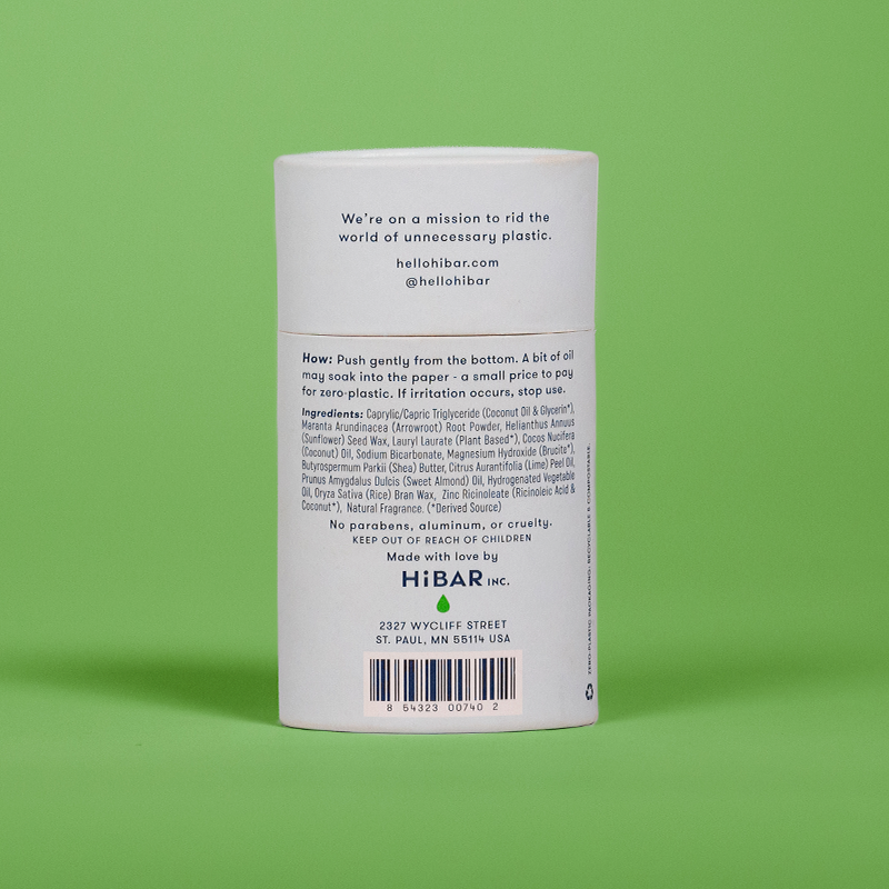 A tube of hi bar fresh rain cucumber deodorant on a green background. 