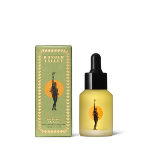 Bottle and box of Wonder Valley hair oil on a white background