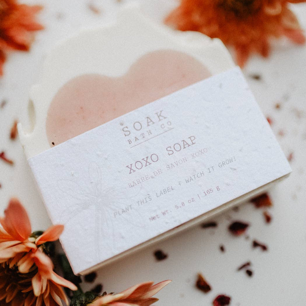 A bar of soak xoxo soap, with orange flowers