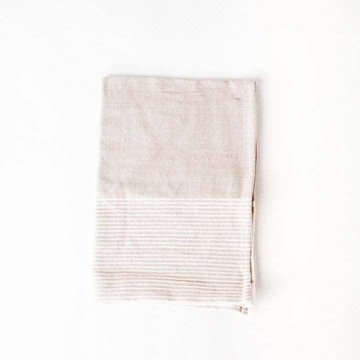 A color block tea towel in beige and white. 
