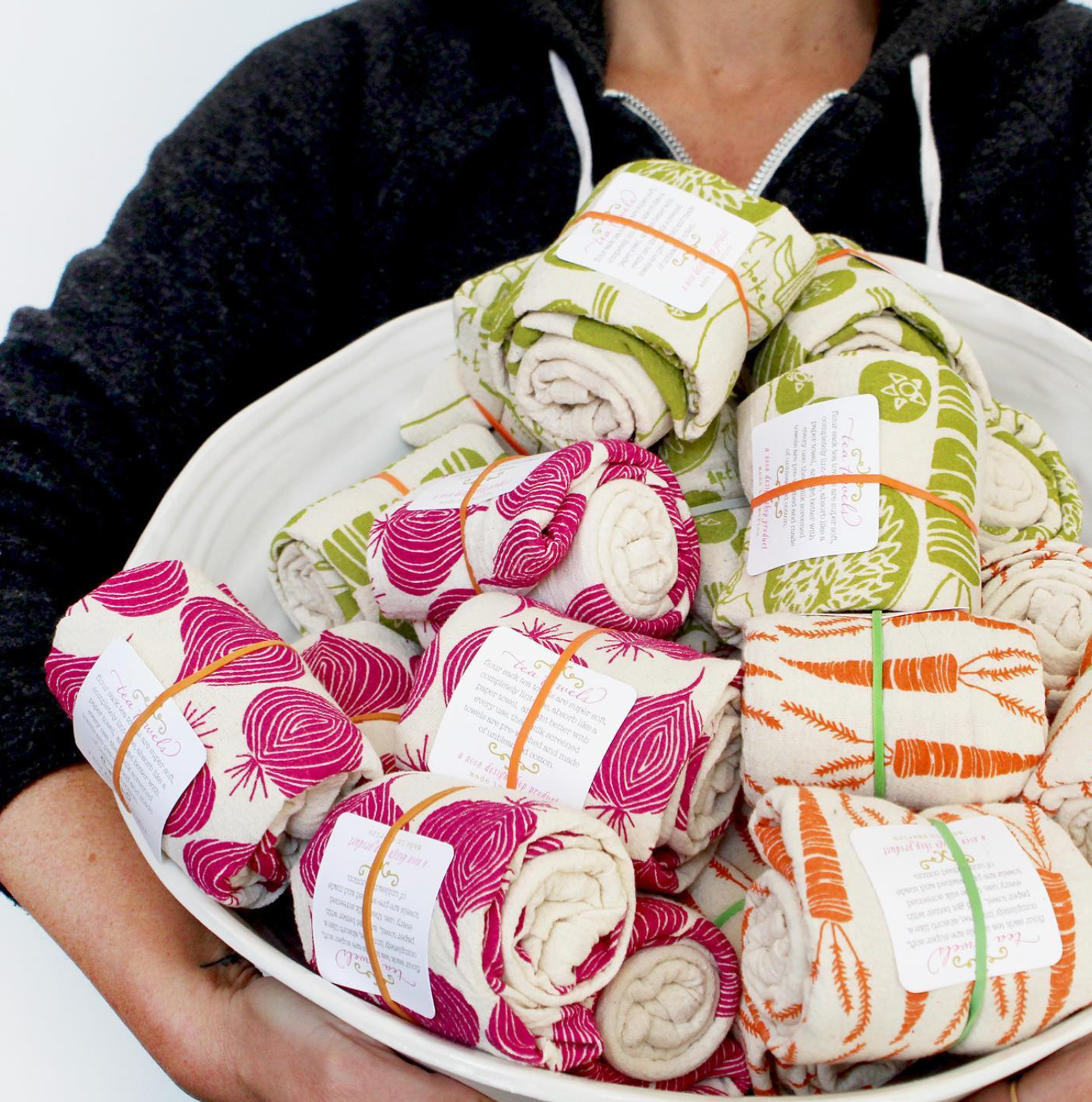 A bowl of Noon Designs tea towels