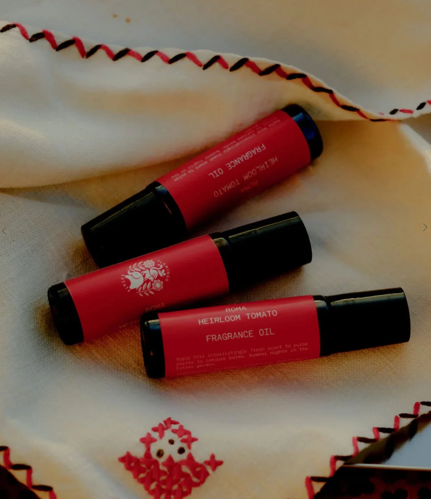 Flamingo Estate roma tomato fragrance oil, in a small brown bottle with a red label