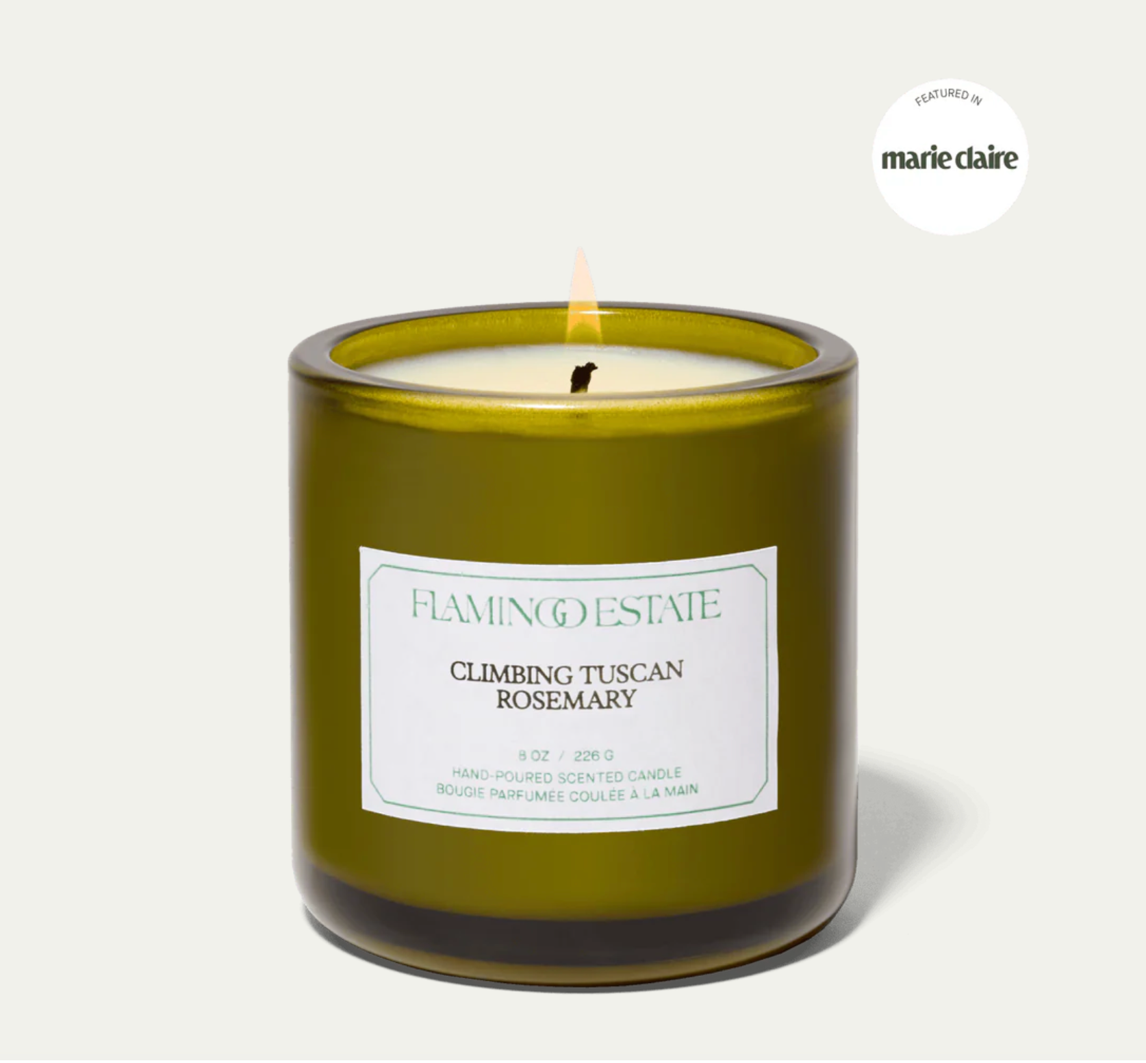 The Flamingo Estate climbing tuscan rosemary candle, in a green glass vessel