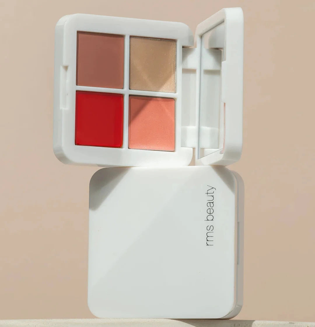 A compact palette with four color shades including red, pink, bronze, and silver, labeled as Lip2Cheek Glow Quad Mini.